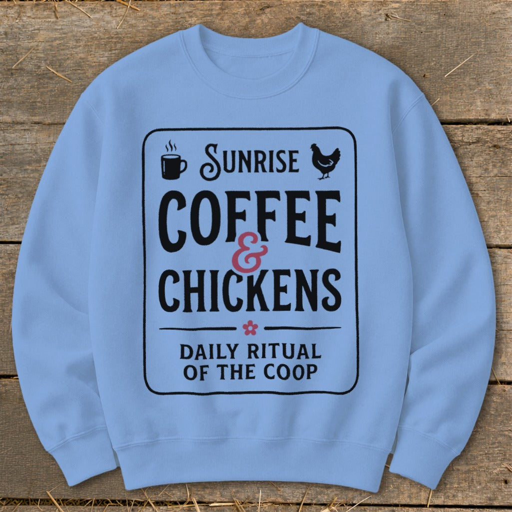 Light blue sweatshirt with black text: "Sunrise Coffee & Chickens Daily Ritual of the Coop".