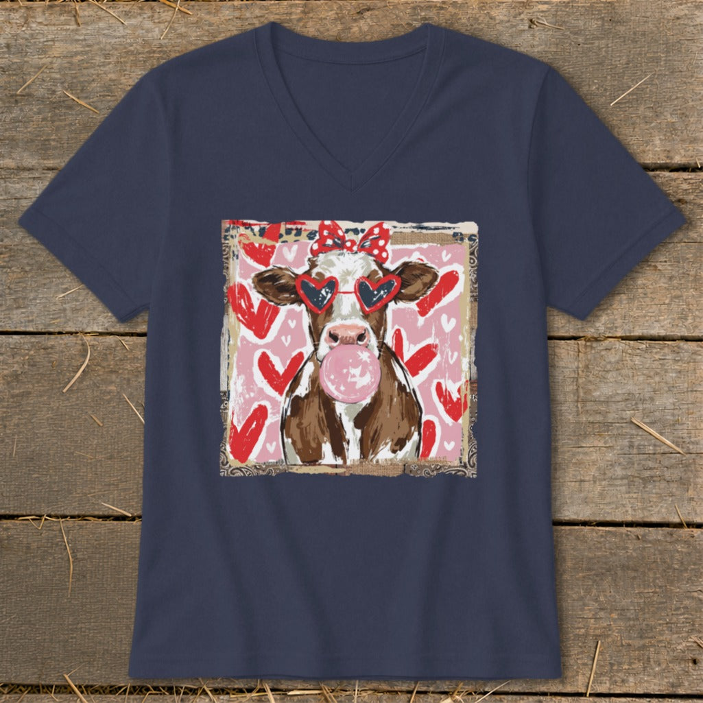 Cow with heart sunglasses and bubblegum on pink background with red hearts.