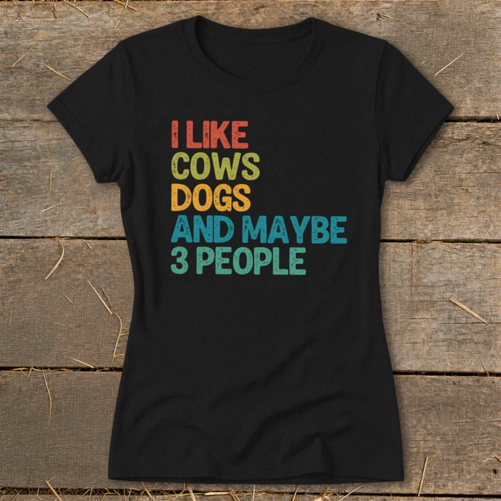Black t-shirt with "I Like Cows Dogs And Maybe 3 People" text.
