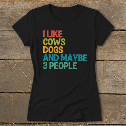 Black t-shirt with "I Like Cows Dogs And Maybe 3 People" text.