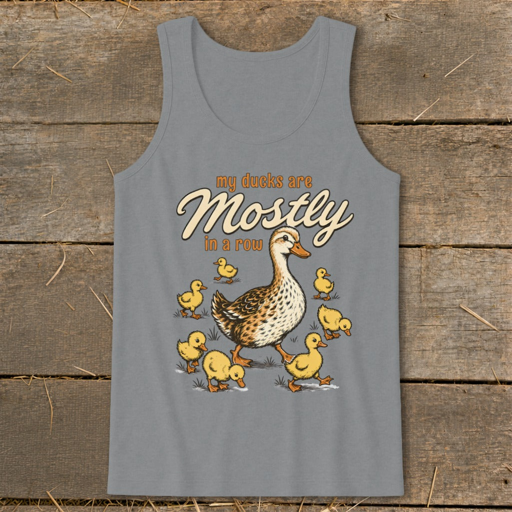 Adult duck and ducklings illustration with text "my ducks are Mostly in a row."