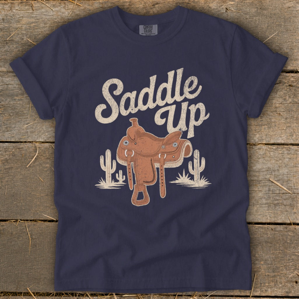 Navy t-shirt with "Saddle Up" text and a brown saddle graphic with cacti.