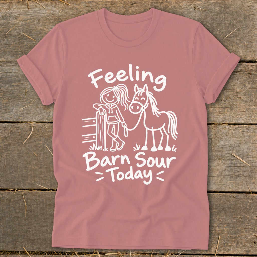 Pink t-shirt with white text "Feeling Barn Sour Today" and horse graphic.