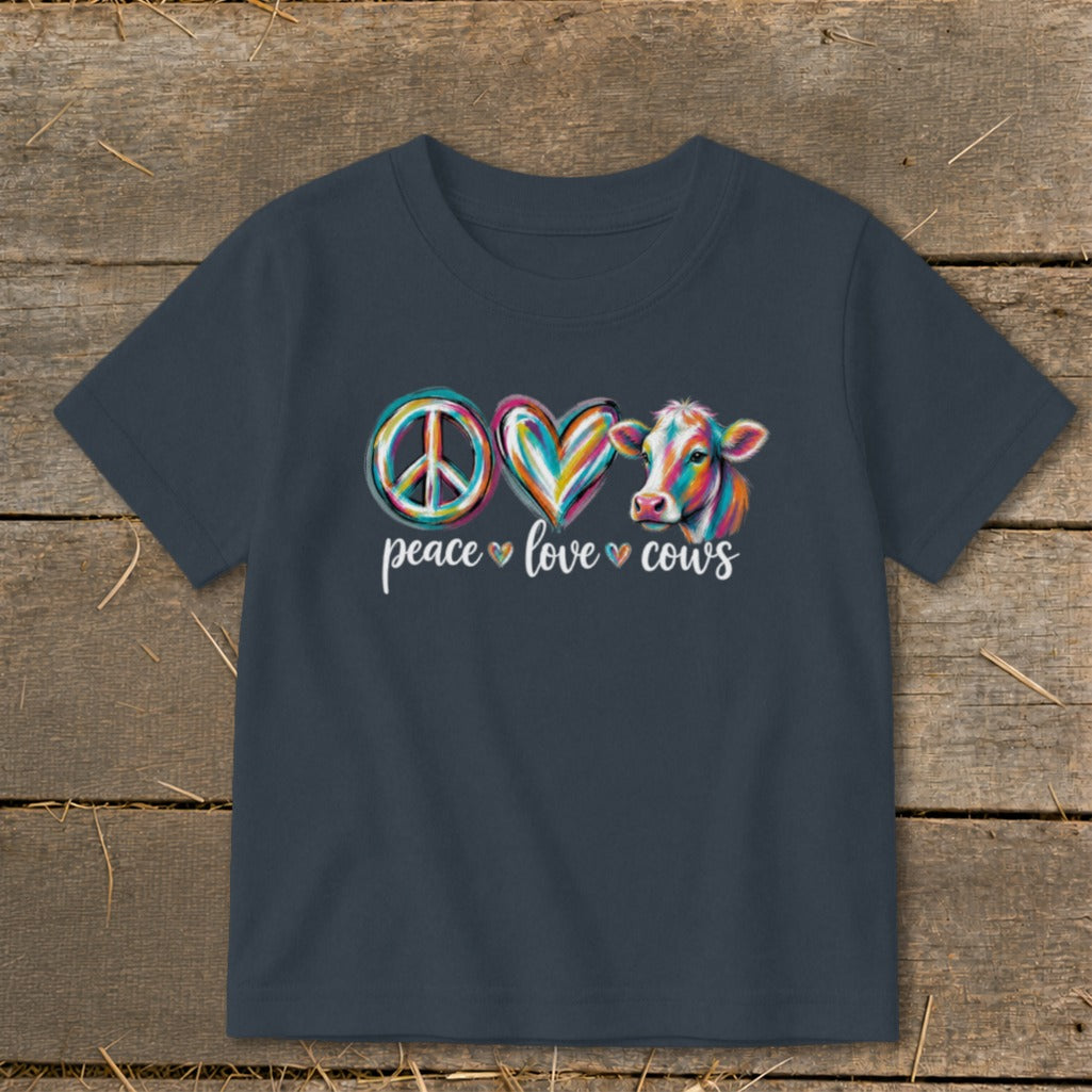 Peace love cows graphic with colorful peace sign, heart, and cow.
