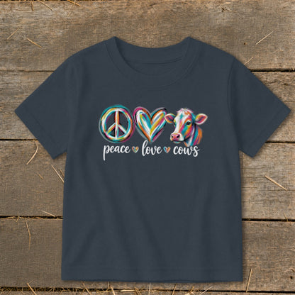 Peace love cows graphic with colorful peace sign, heart, and cow.