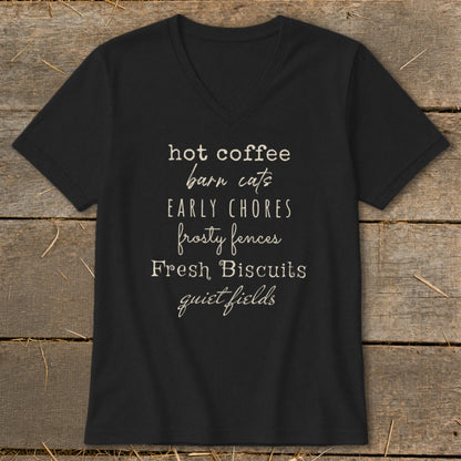 Black t-shirt with text listing: hot coffee, barn cats, early chores, frosty fences, fresh biscuits, quiet fields.