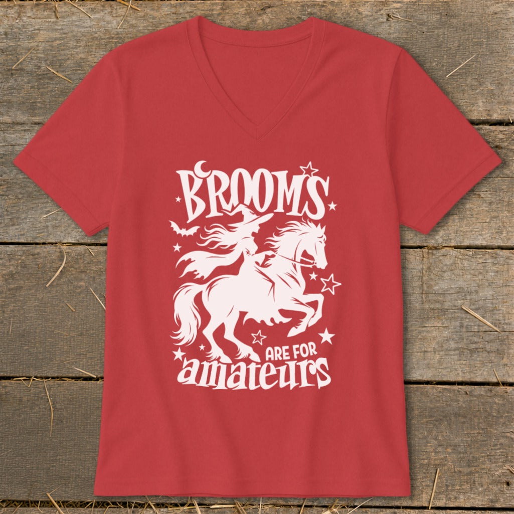 Red t-shirt with white graphic of witch on horse, text "BROOM'S ARE FOR AMATEURS".