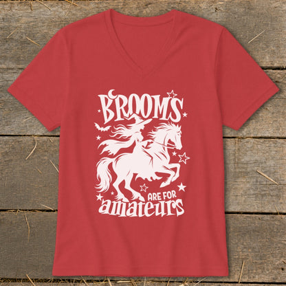 Red t-shirt with white graphic of witch on horse, text "BROOM'S ARE FOR AMATEURS".