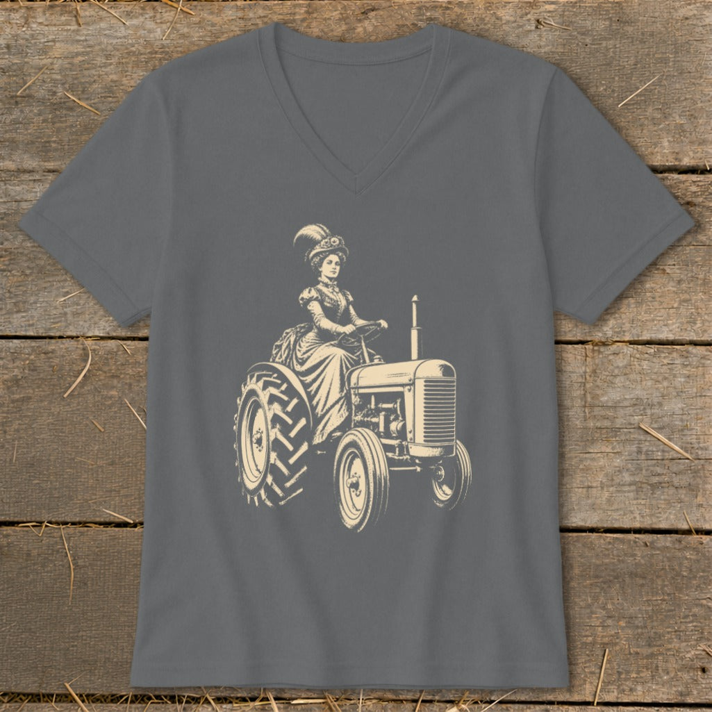 Vintage illustration of woman in ornate hat driving a tractor on grey t-shirt.