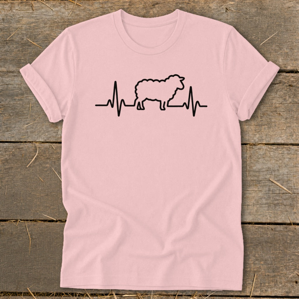 A pink t-shirt featuring a black graphic of a sheep integrated into a heartbeat line.