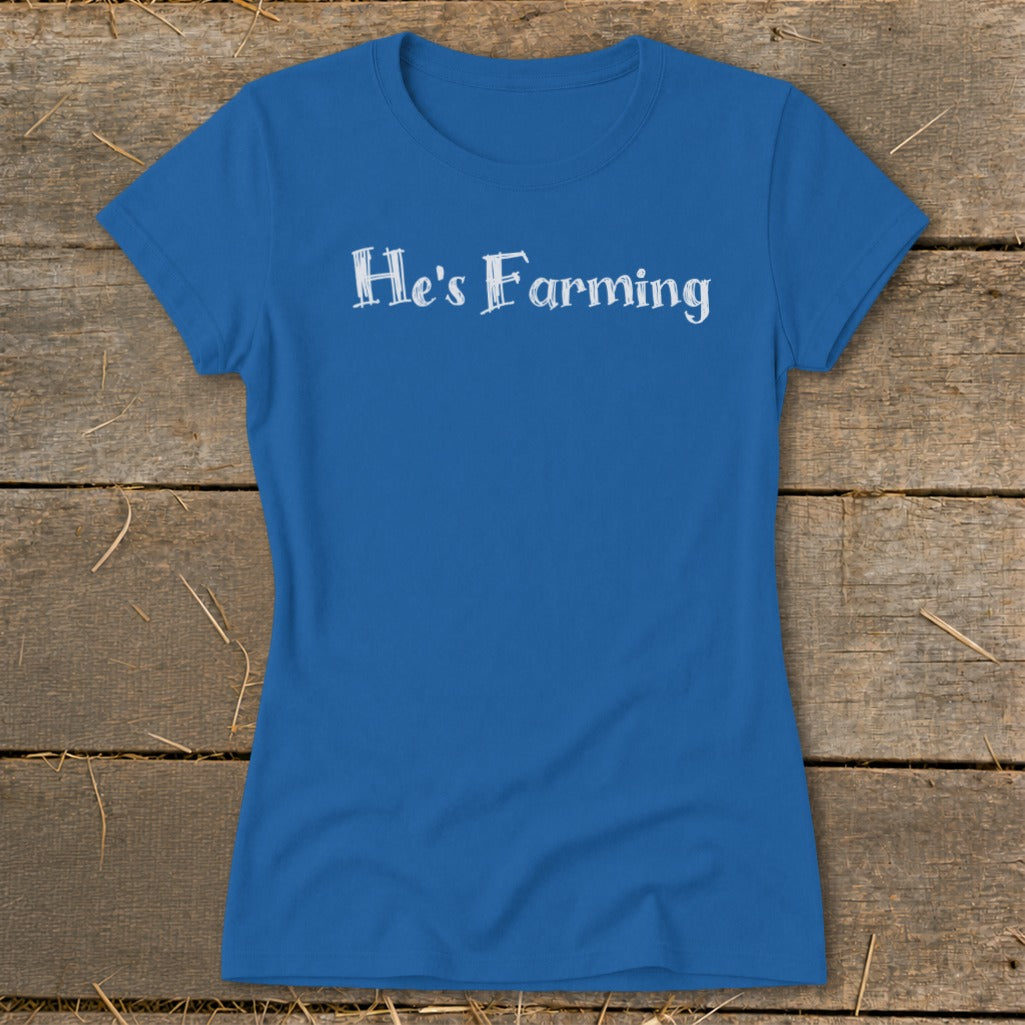Blue t-shirt with "He's Farming" in white text.
