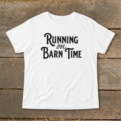 White t-shirt with black text "Running on Barn Time"