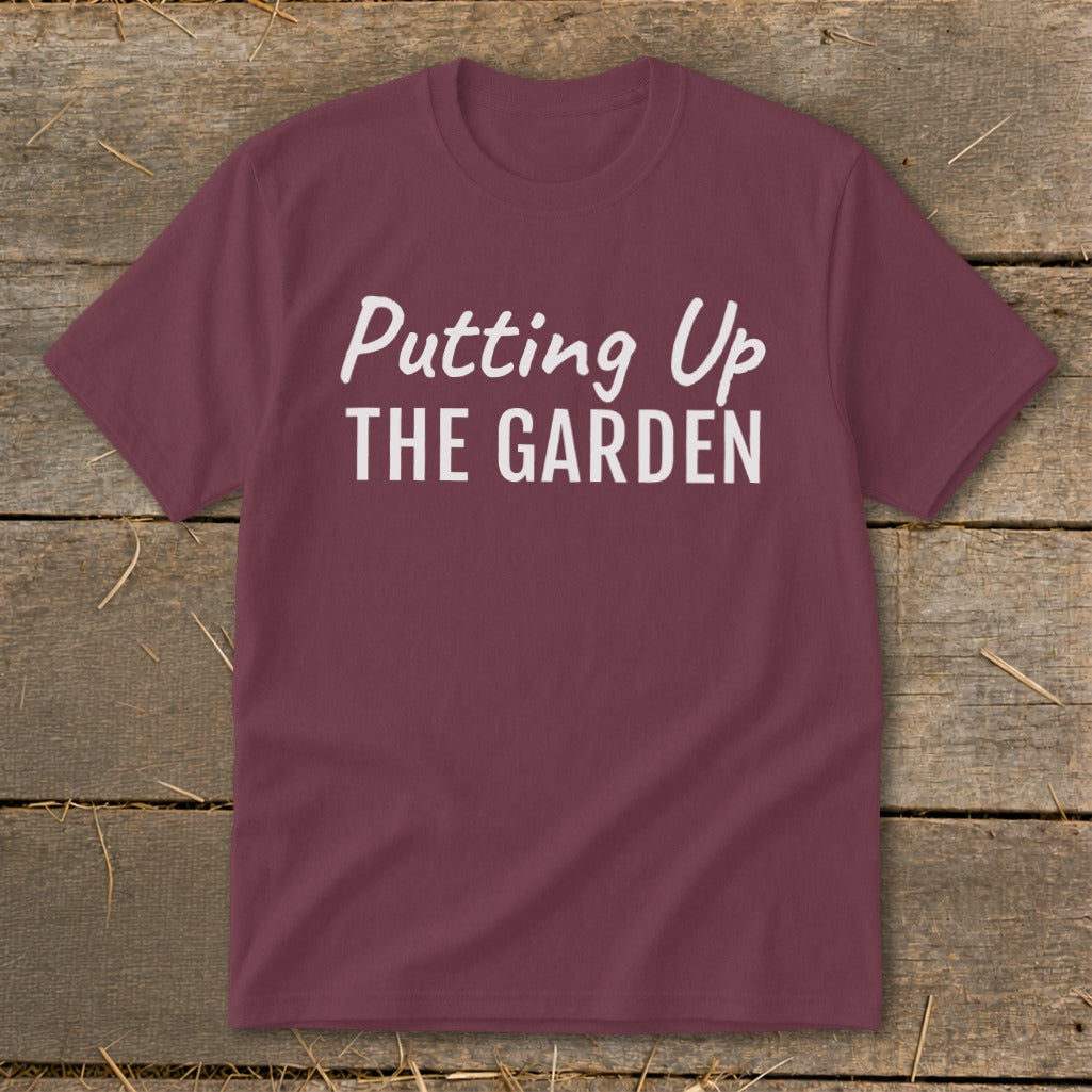 Maroon t-shirt with white text "Putting Up THE GARDEN".
