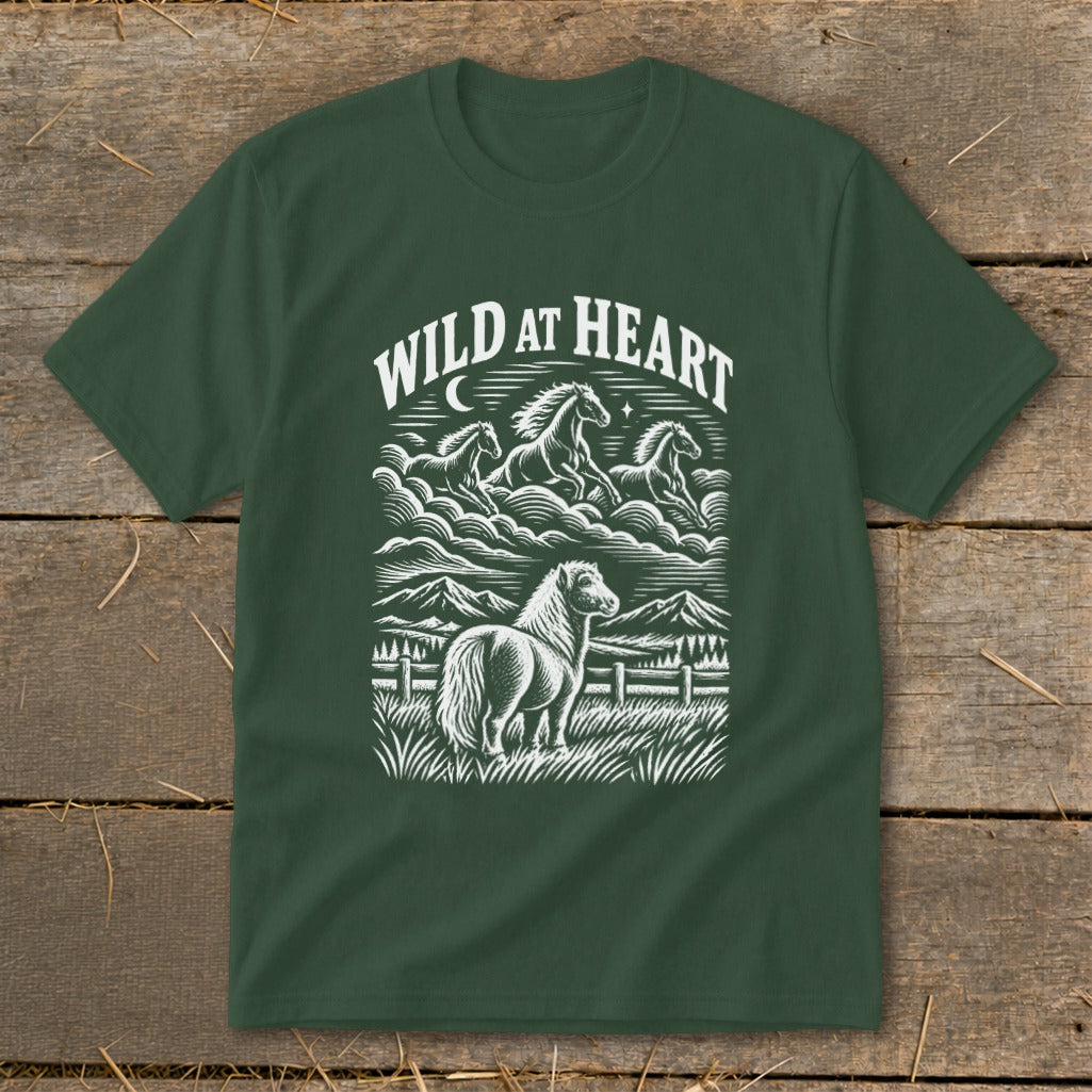 Dark green t-shirt with "Wild at Heart" text and a horse landscape illustration.