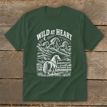 Dark green t-shirt with "Wild at Heart" text and a horse landscape illustration.