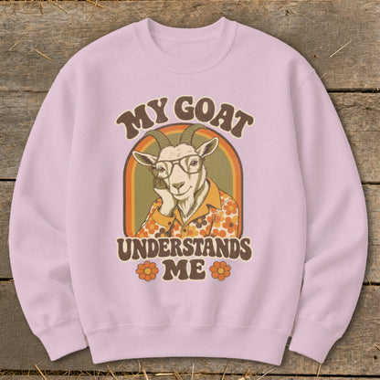 Pink sweatshirt with retro graphic of a goat wearing glasses and shirt saying "My Goat Understands Me".