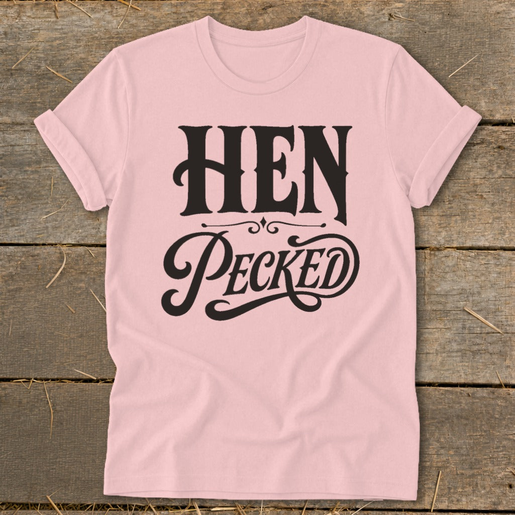 Light pink t-shirt with black text reading "HEN PECKED" in stylized lettering.