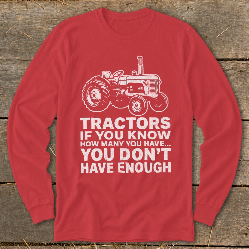 Red long-sleeve shirt with a graphic of a tractor and the text "Tractors if you know how many you have... you don't have enough".