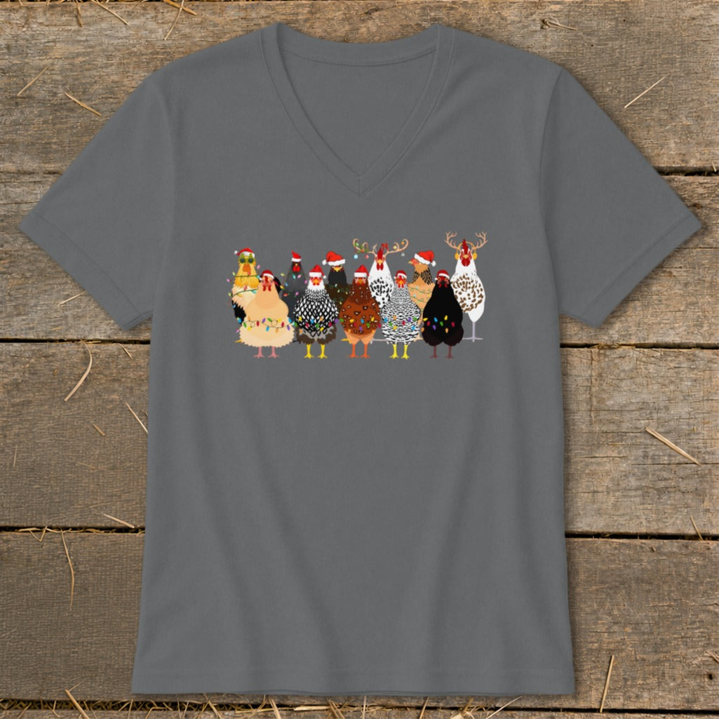 Group of chickens wearing Santa hats and Christmas lights.