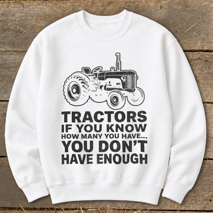 White sweatshirt with tractor graphic and text "Tractors If You Know How Many You Have... You Don't Have Enough".