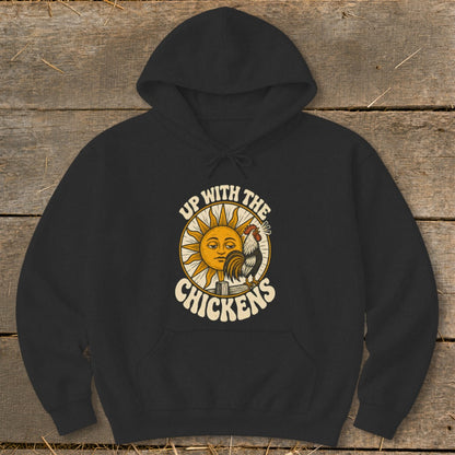 Black hooded sweatshirt featuring a graphic of a rooster, a sleepy sun, and the text Up With The Chickens.