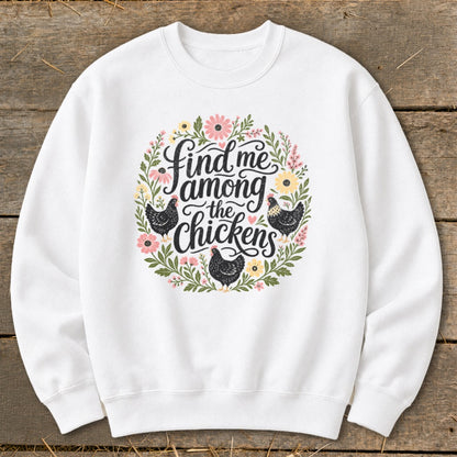 White sweatshirt with floral wreath and chickens graphic saying "find me among the chickens."