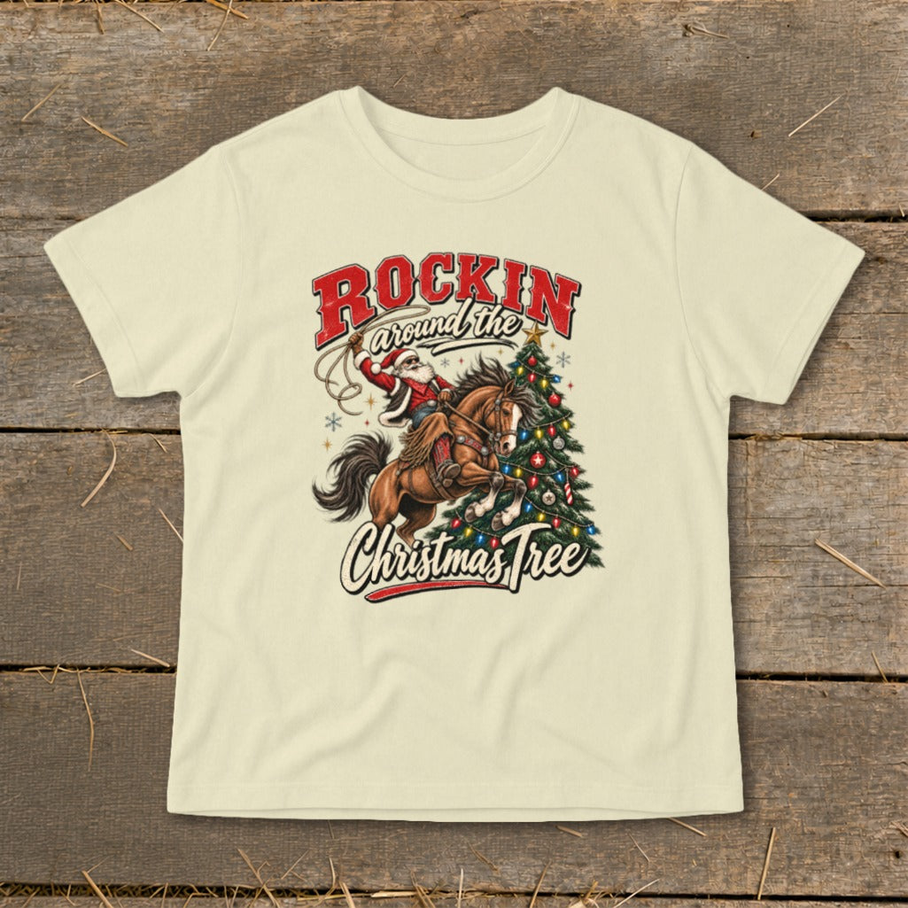 Santa on horseback with a lasso next to a Christmas tree, reads "Rockin around the Christmas Tree".