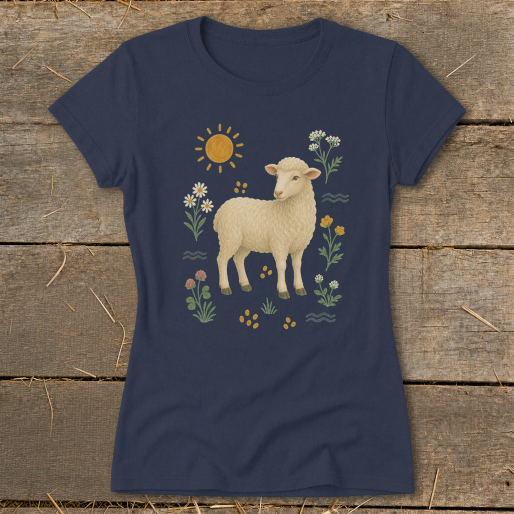 Navy t-shirt with a cream sheep surrounded by a sun, flowers, and grass.