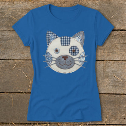 Blue t-shirt with a fabric applique of a cat's face.