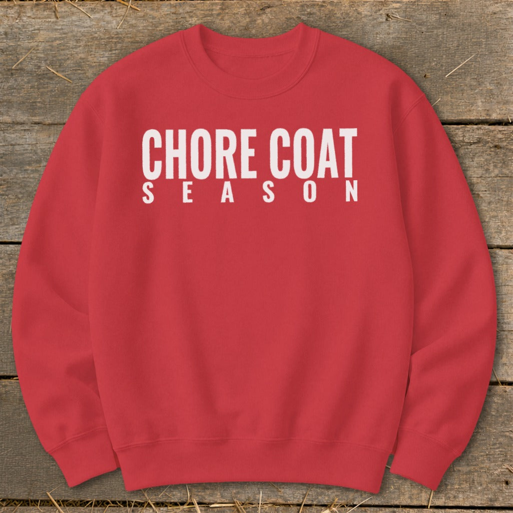 Red crewneck sweatshirt with white text reading "CHORE COAT SEASON".
