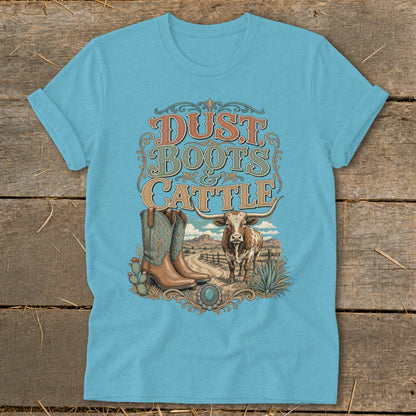 Cyan t-shirt with "Dust, Boots & Cattle" graphic featuring boots, a longhorn, and a desert landscape.