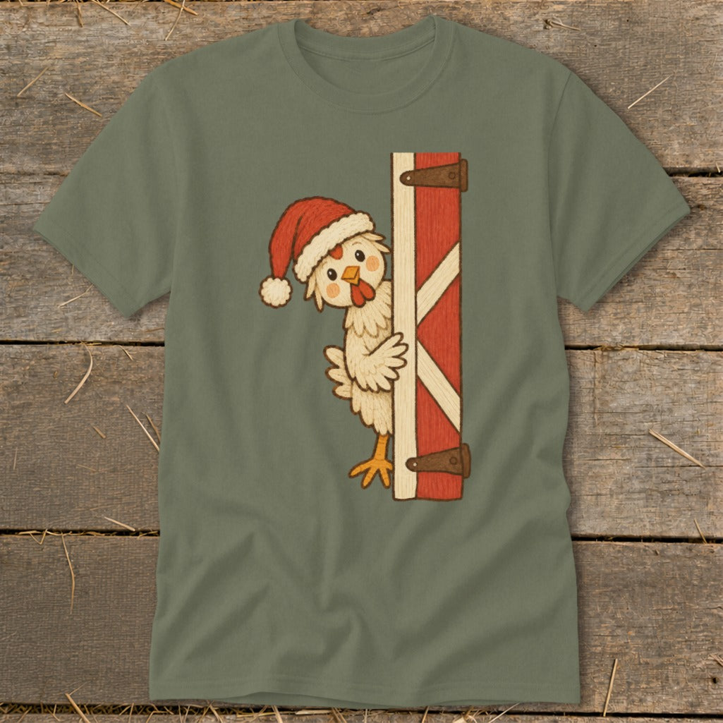 Cute chicken wearing a Santa hat peeking from a red barn door.