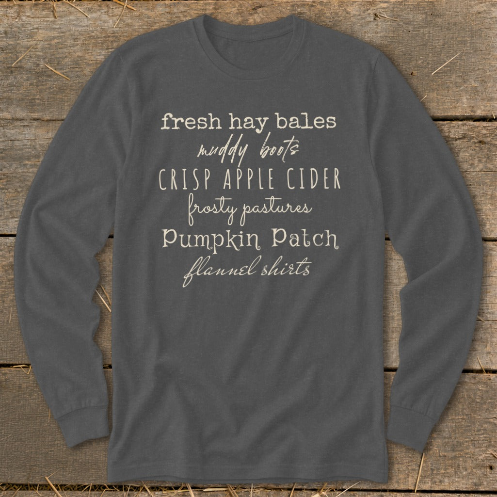 Long sleeve shirt with fall sayings: fresh hay bales, muddy boots, crisp apple cider.