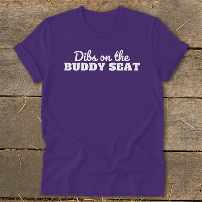 Purple t-shirt with white text "Dibs on the BUDDY SEAT".