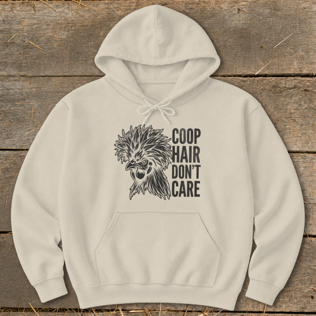 Cream hoodie with black graphic of a chicken and text "COOP HAIR DON'T CARE".