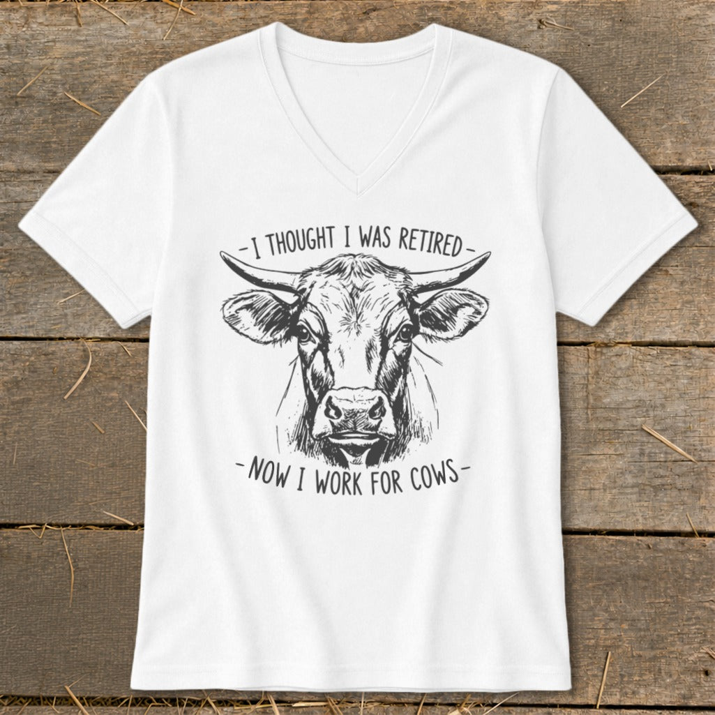 White t-shirt with sketch of a bull's head and text "I thought I was retired - now I work for cows".
