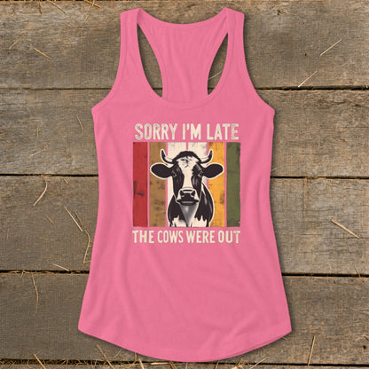 Pink tank top with a cow graphic and text "Sorry I'm late, the cows were out."