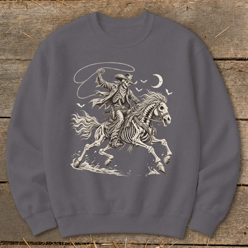 Skeleton cowboy on horseback with lasso, moon, and birds.