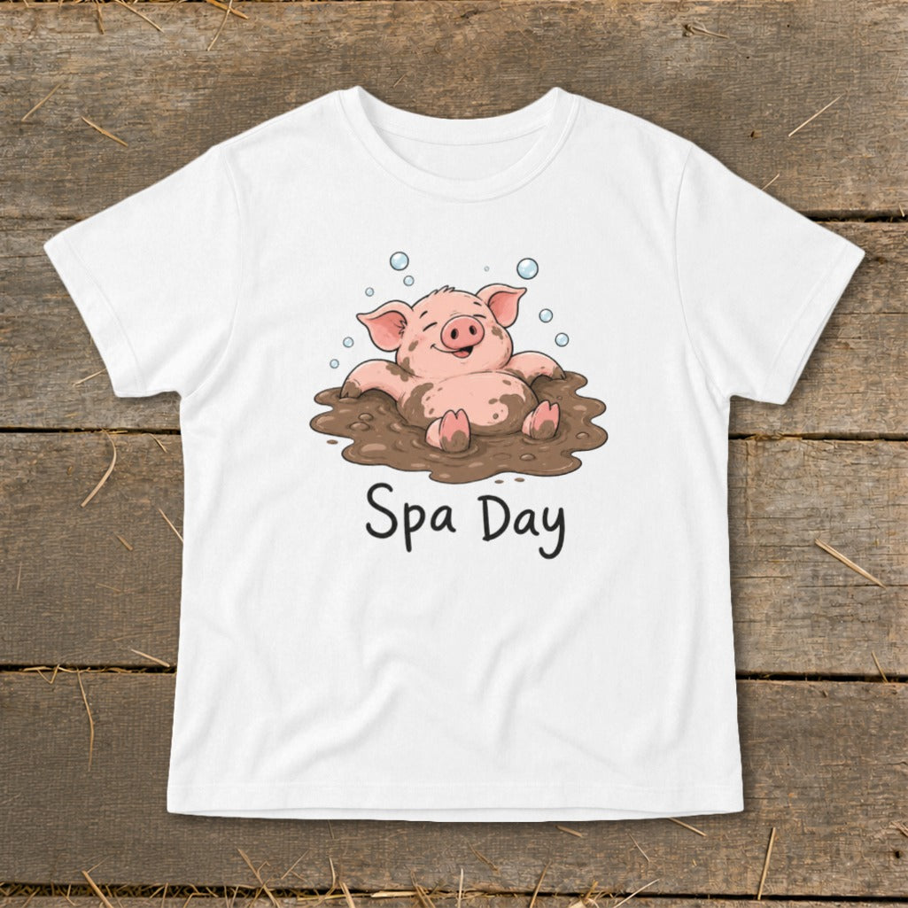 White t-shirt with illustration of a happy pig in mud, reading "Spa Day".