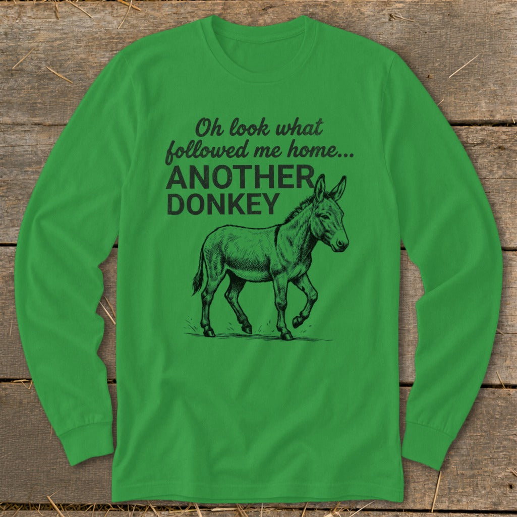 Green long-sleeve shirt with text "Oh look what followed me home... ANOTHER DONKEY" and a donkey illustration.
