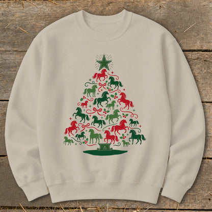 Light tan sweatshirt with a Christmas tree made of red and green horses and holly.