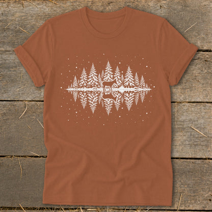 Brown t-shirt with white graphic of trees and a deer reflected in water.