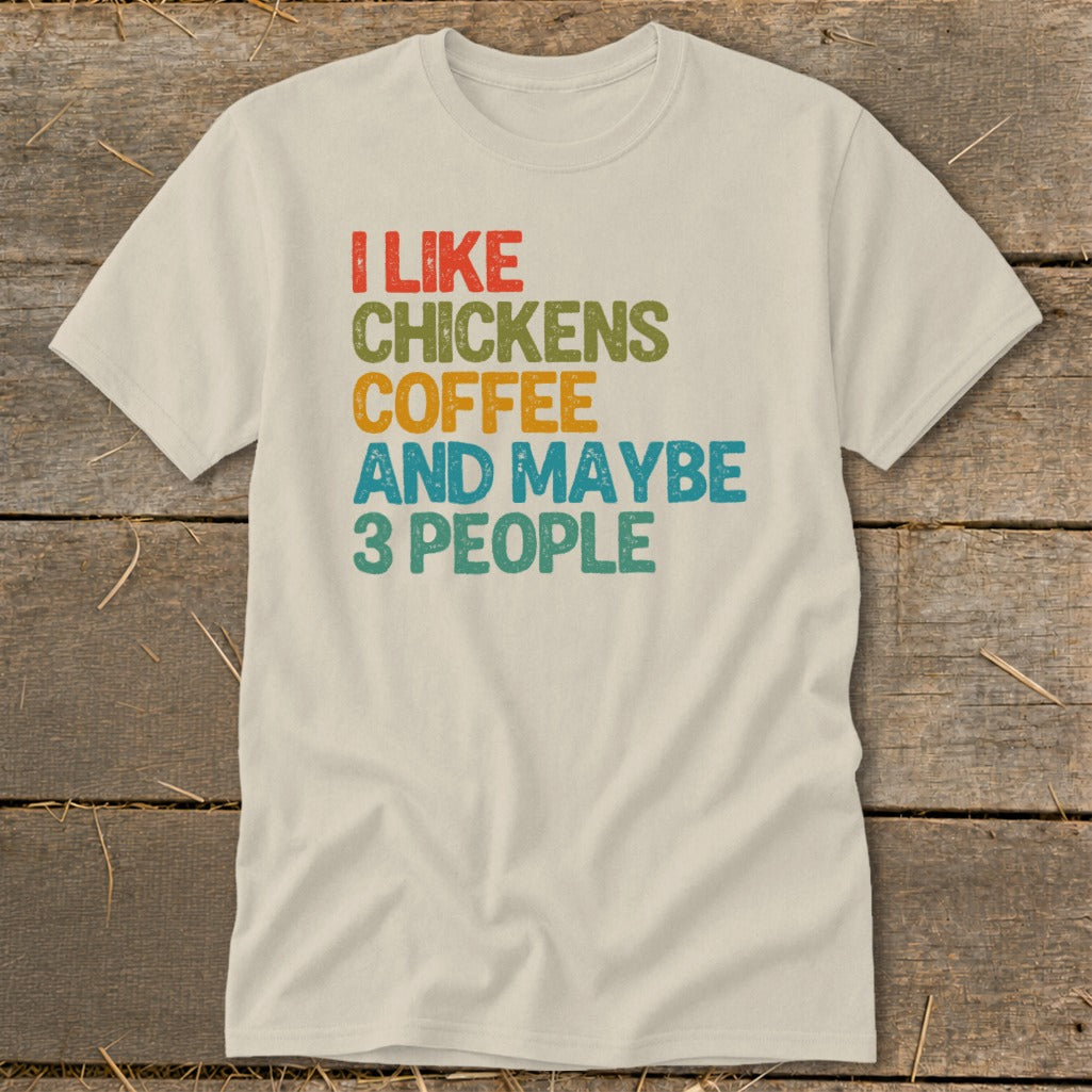Cream t-shirt with "I like chickens coffee and maybe 3 people" text.