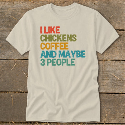 Cream t-shirt with "I like chickens coffee and maybe 3 people" text.