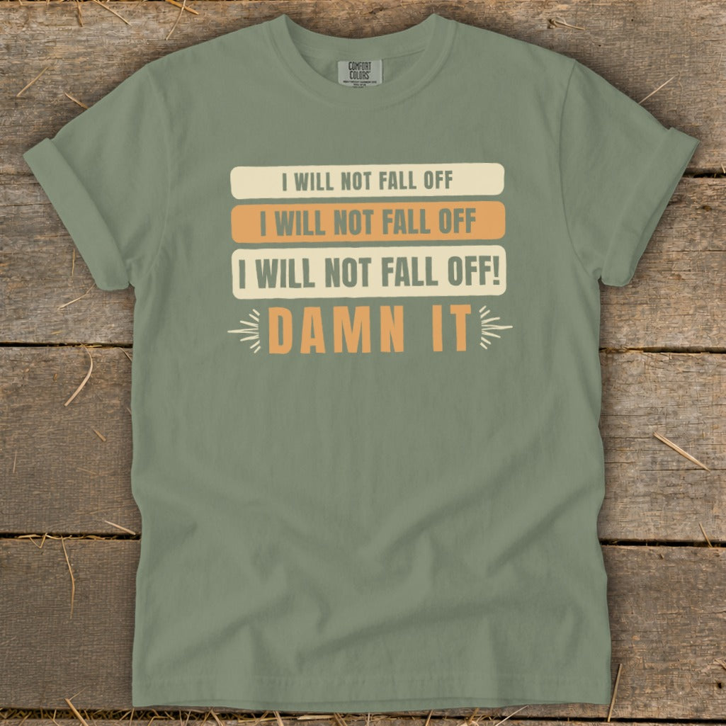 Green t-shirt with text "I WILL NOT FALL OFF" and "DAMN IT".