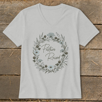 Gray v-neck t-shirt with a floral wreath design and "Pasture Raised" text.