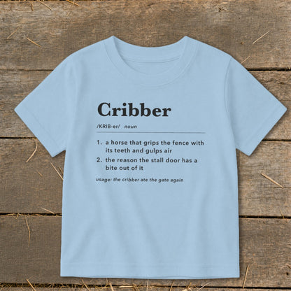 Light blue t-shirt featuring dictionary-style definitions for the word Cribber printed on the chest.