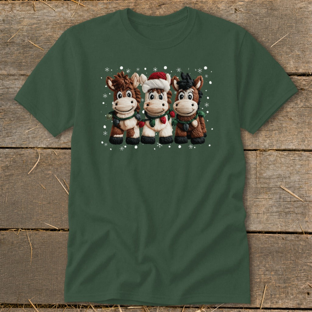 Three cartoon horses wear Christmas lights and scarves, with one in a Santa hat.