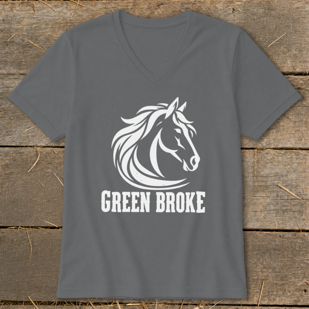A charcoal grey V-neck t-shirt with a white graphic of a horse head and the text GREEN BROKE on a rustic wooden background.