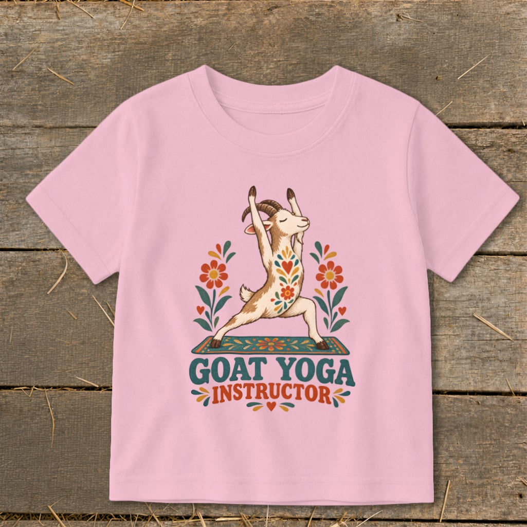Pink t-shirt with a goat doing yoga and the text "GOAT YOGA INSTRUCTOR".